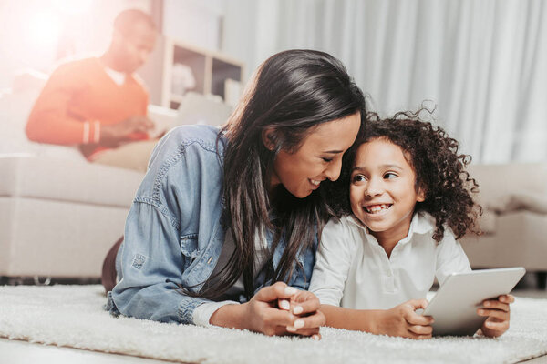 Glad mom and daughter having good time inside