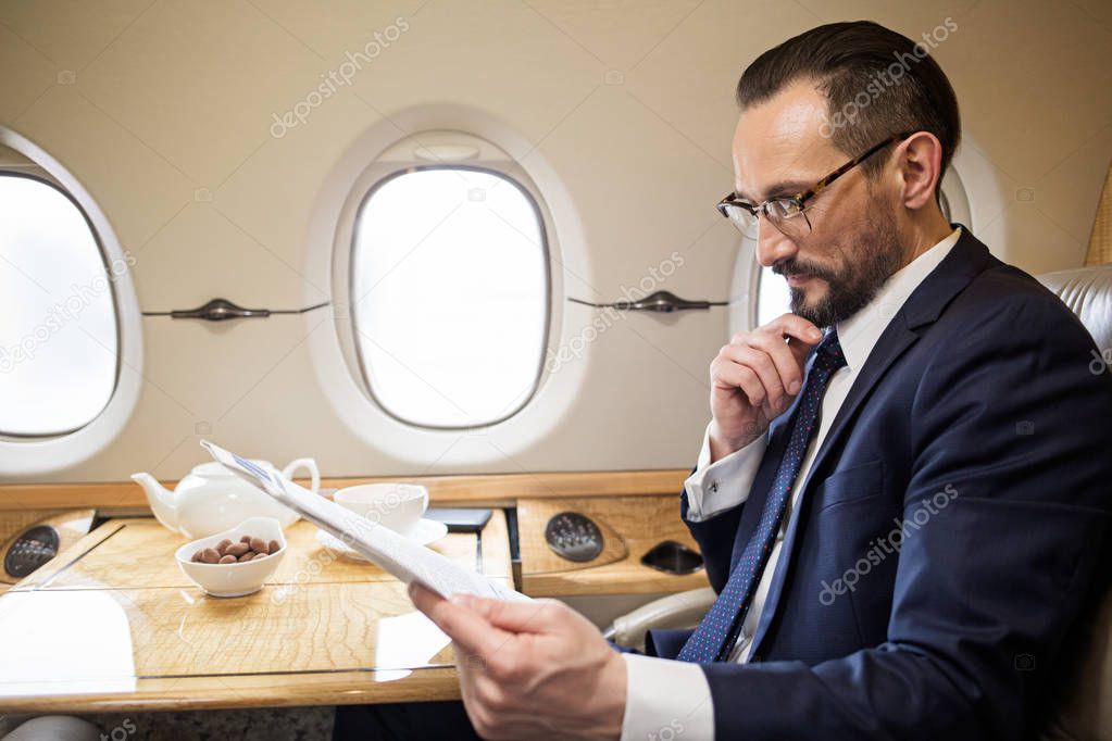 Calm passenger enjoying his first class flight