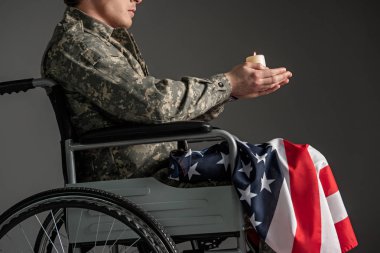 Handicapped male veteran praying for his future clipart