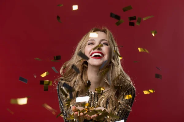 Happy woman having fun with confetti — Stock Photo, Image