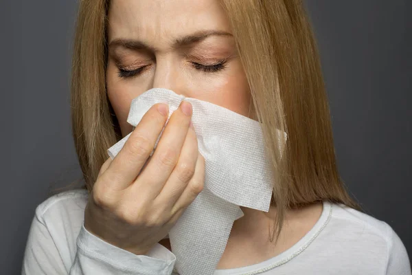 Displeased young female having cold — Stock Photo, Image