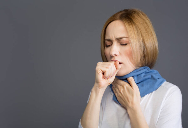 Sick adult woman having cough
