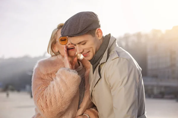 Young woman is telling tender words to her stylish man — Stock Photo, Image