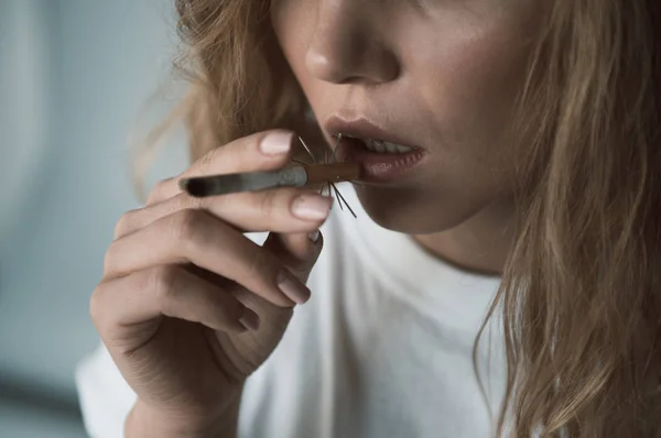 Serene woman fuming dangerous rollup — Stock Photo, Image