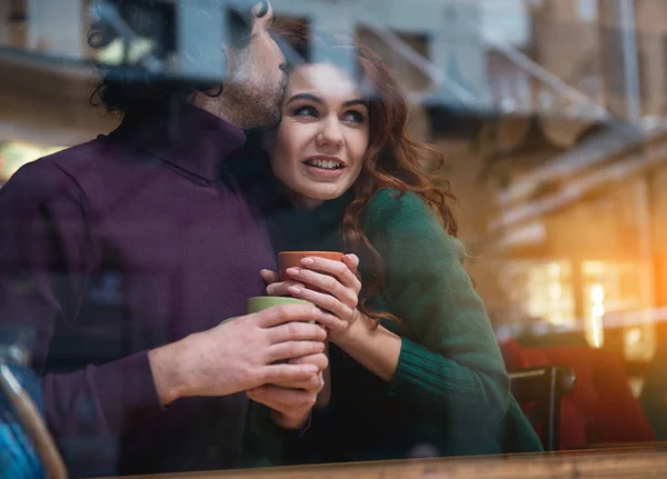 Cheerful guy kissing girl with love — Stock Photo, Image