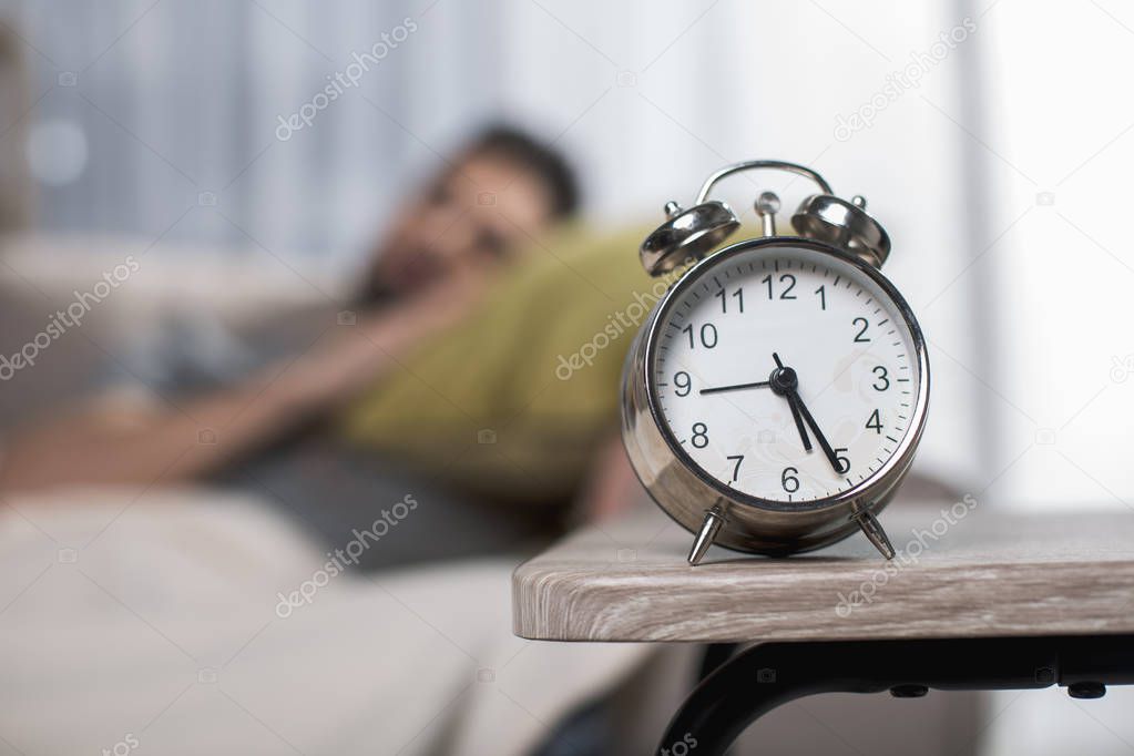 Peaceful male sleeping at home