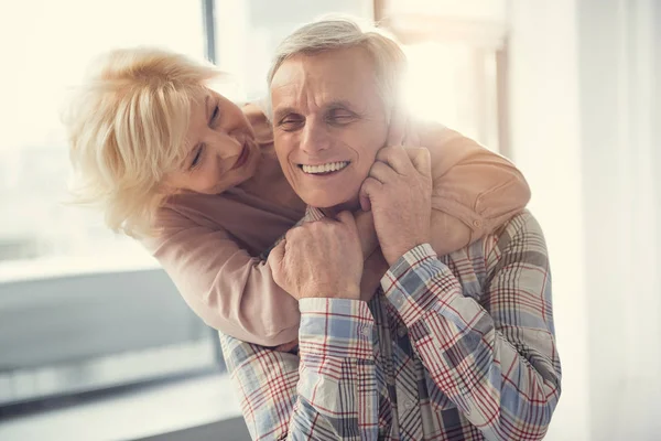 Senior woman showing love to old man — Stock Photo, Image