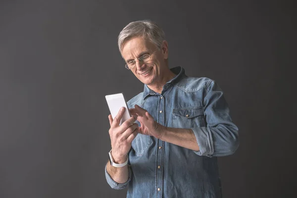 Happy retire male keeping phone — Stock Photo, Image