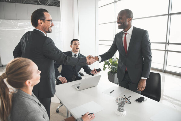 Business team getting together in meeting room