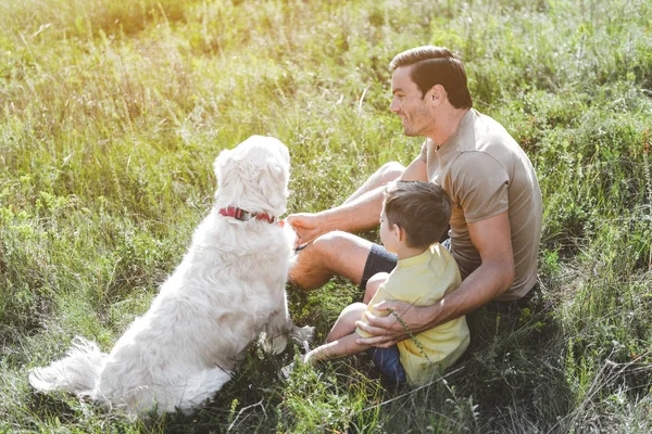 Young carefree family resting outdoors — Stock Photo, Image