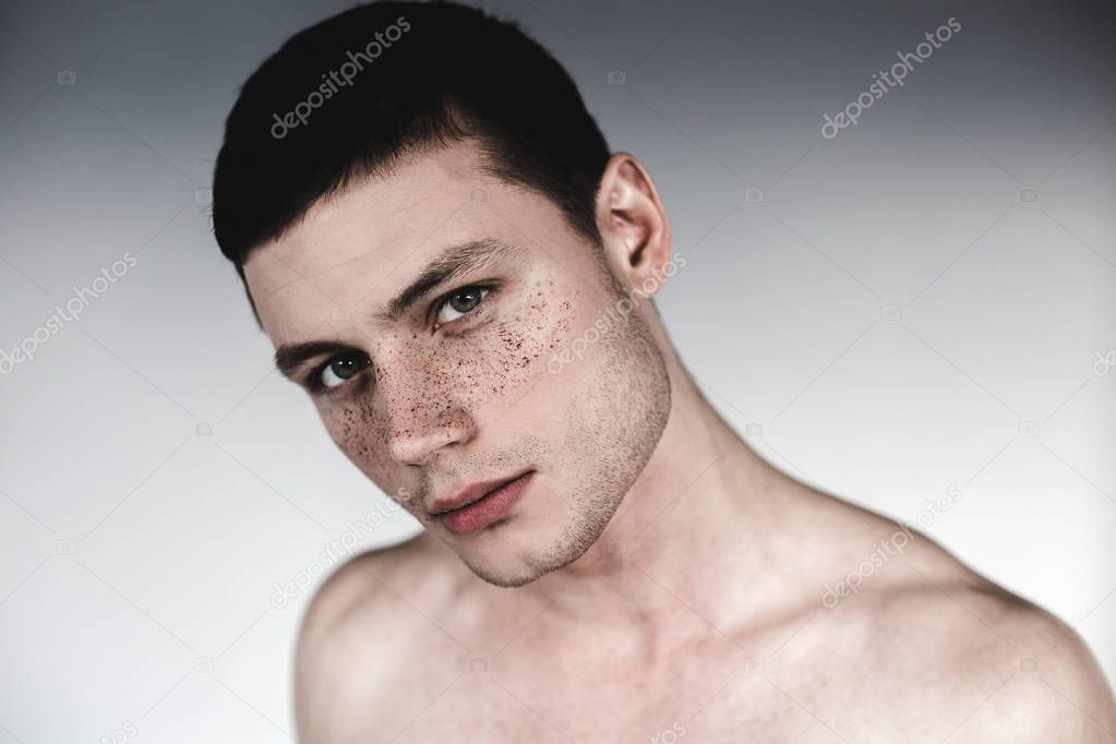 Cool man having many freckles on face