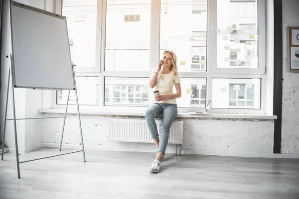 Female worker having coffee pause