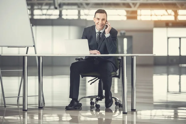 Happy employer speaking by phone — Stock Photo, Image