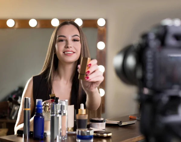 Positive young woman is recording video — Stock Photo, Image