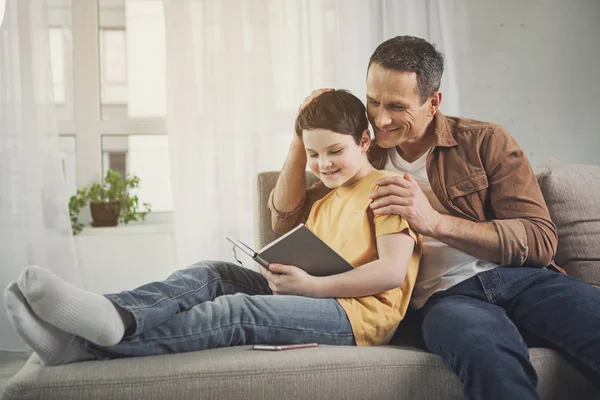 Happy family entertaining together at home — Stock Photo, Image