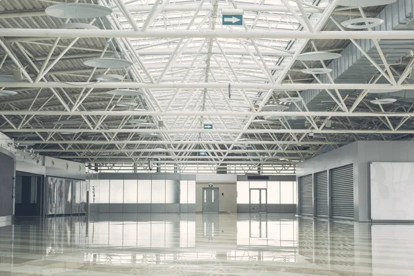 Huge modern storehouse with concrete floor