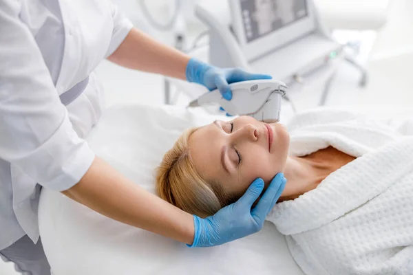 Adult woman getting lifting therapy in beauty salon — 스톡 사진