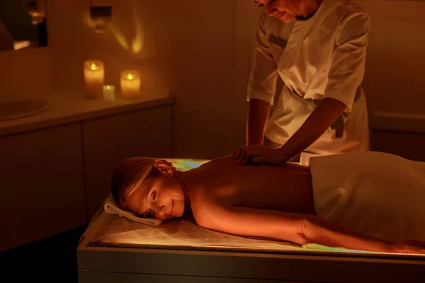 Half naked lady is relaxing during massage — Stock Photo, Image