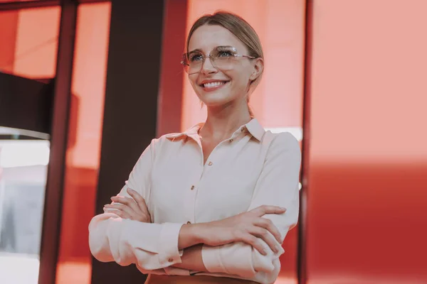 Beautiful young woman in glasses crossing arms — 스톡 사진