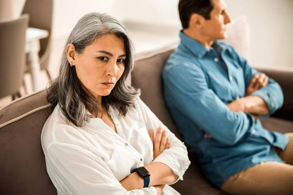 Serious adult lady being mad at her husband in room — Stock Photo, Image
