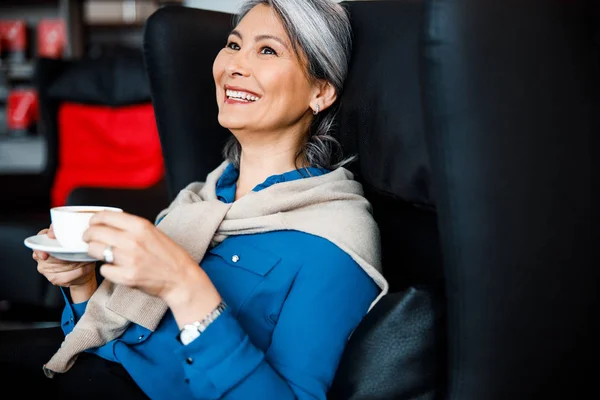 Woman with coffee being in good mood stock photo — Stock Photo, Image