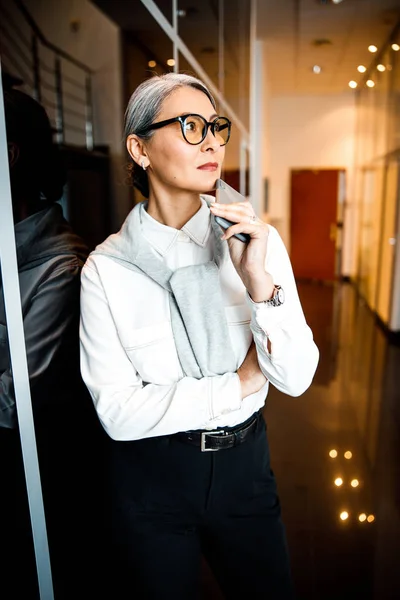 Thoughtful elegant woman in the hall stock photo — Stock Photo, Image