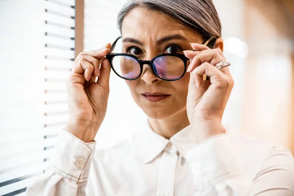 Attractive woman wearing new glasses stock photo — 스톡 사진