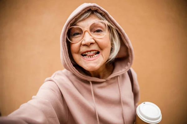 Jolly old lady making faces stock photo — Stock Photo, Image