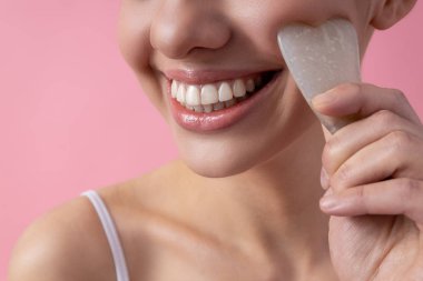 Close up of Gua Sha face therapy stock photo