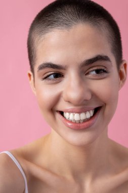 Face of the young smiling woman looking happy stock photo