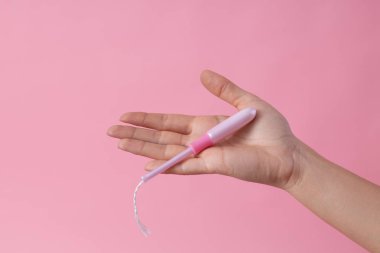 Menstruation tampon in open hand stock photo