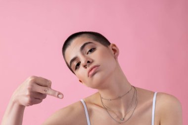 Rude young girl showing middle finger stock photo