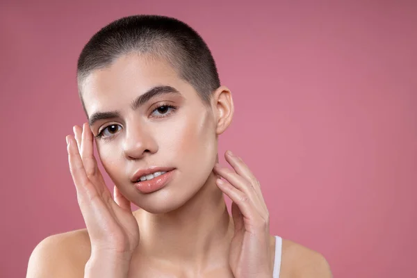 Short haired lady on pink background stock photo — Stock Photo, Image