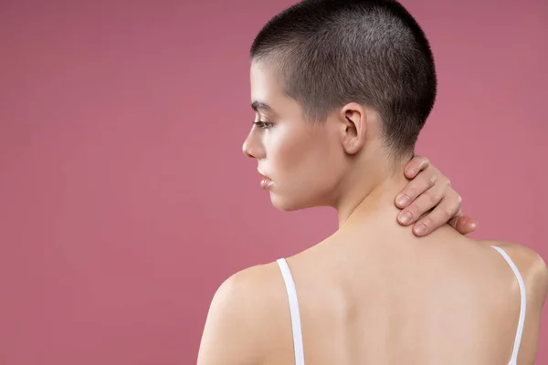 Thoughtful lady touching the back of her neck stock photo — 스톡 사진