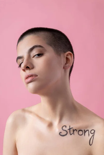 Woman demonstrating her protest with tattoo stock photo — Stockfoto