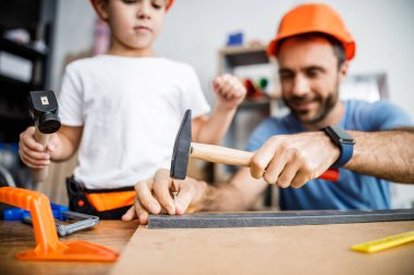 Happy father and son working with nails stock photo