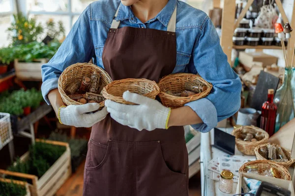 Female wearing an apron and work gloves — Stock Photo, Image