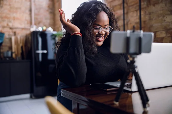 Mirthful lady with laptop and smartphone stock photo — Stock Photo, Image