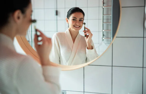 Cheerful girl taking care of face stock photo — Stock Photo, Image