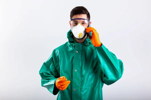 Person having phone talk while being in protective garment stock photo — Stock Photo, Image