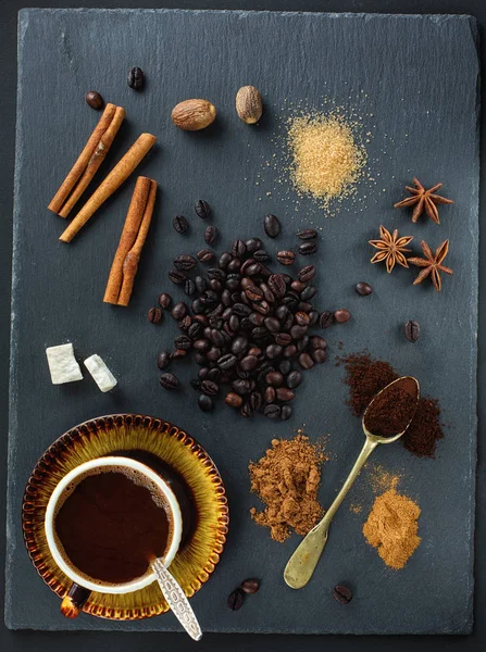 Coffee and spices on a dark background