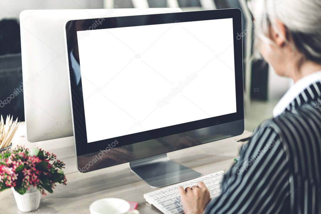 Business woman using computer with white mockup blank screens in