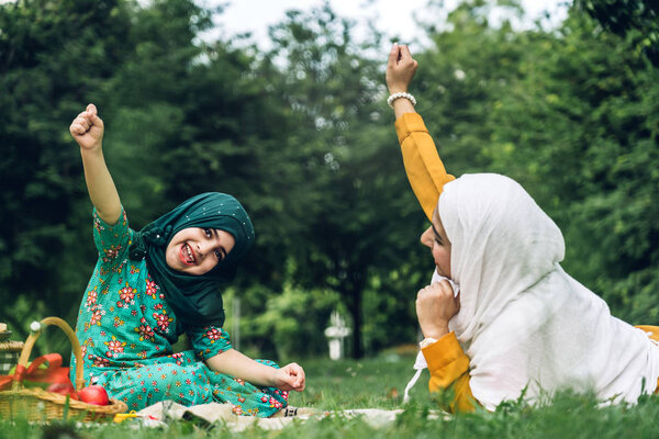 Portrait of happy muslim mother and little muslim girls child  w