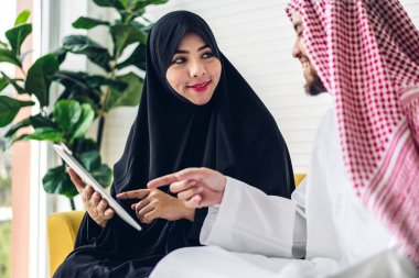 Two arabic business people working with tablet computer.creative clipart