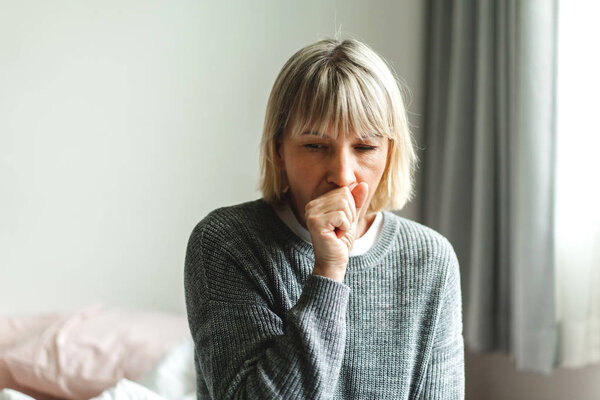 Sick senior adult elderly asia women feeling unwell coughing wit