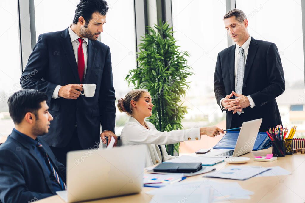 Group of professional business meeting and discussing strategy with new startup project.Creative business people planning and brainstorm with laptop computer in modern office.Teamwork concept