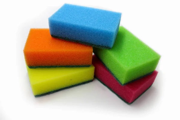 Multicolored sponges for washing dishes on a white background Stock Image