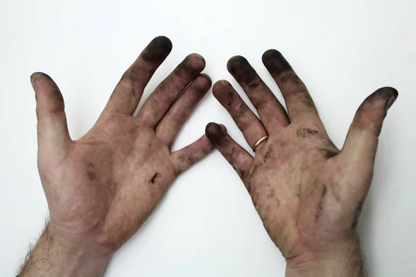 Dirty hands of a man on a white background — Stock Photo, Image