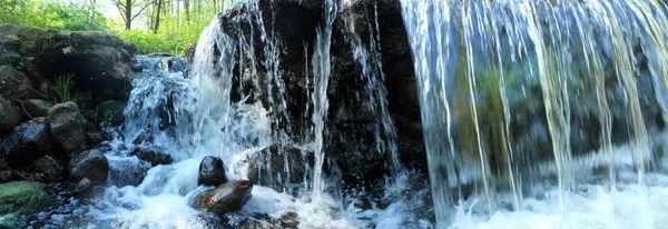 Panoramic image of the small mountain waterfall. — Stock Photo, Image