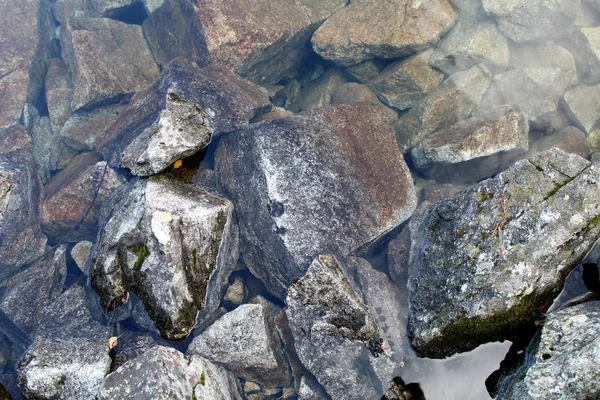 Large boulders in the water as a background image. — Stock Photo, Image